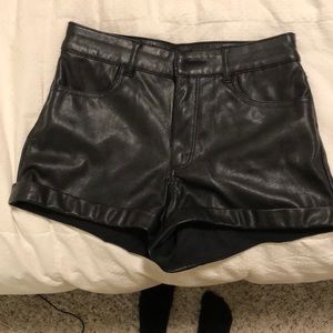 Mid/high rise black faux leather shorts